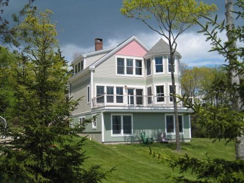 The deck and bedrooms look out on a beautiful ocean view.