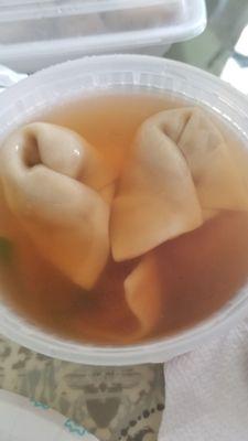 Wonton soup in a dark broth