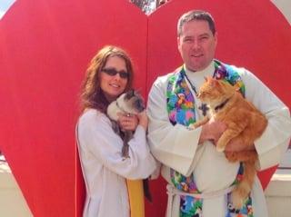 Pastor Scott and Alia Bartlett with their cats.