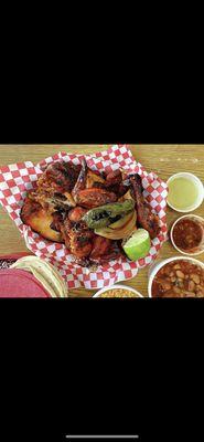 Whole Chicken cooked in charcoal , comes with tortilla, beans, rice , onion