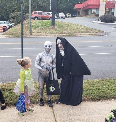 A little bit of Halloween Fun this little guy won the trophy for best costume and got his picture taken with the NUN.