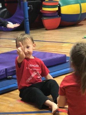 Peace from my little gymnast who has gained wonderful confidence and skill these last few years!