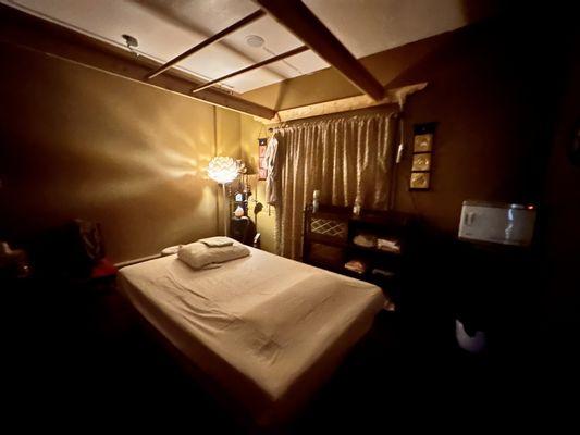 Thai Massage room with Ashiatsu bars on the ceiling.