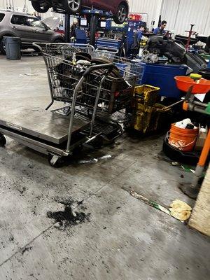 Neighboring businesses shopping carts used for parts containment.