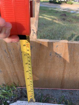 This form board shows where the patio should have been poured to make it level. It is over 8" below where it should have been!