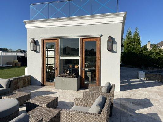 Doors after sanding and 2 coats of teak oil as well as painted pool house