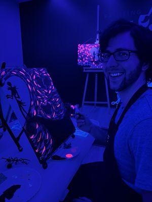 Painting in the dark with black light paint.