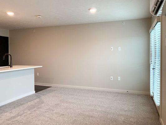 The Finch studio apartment with white cabinets.