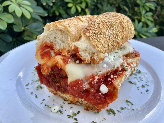 Half meatball sub with marinara & mozzarella sprinkled with pecorino Romano.