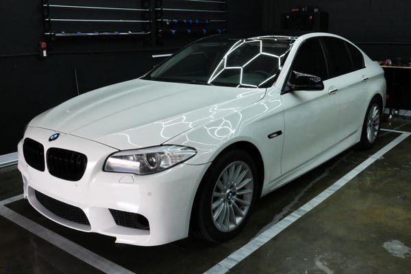 Space Grey BMW F10 wrapped in Gloss white with black roof.