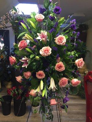 Flowers on a stand for a family friends mother's funeral services.