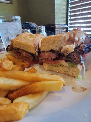 Grilled prime rib sandwich and fries.