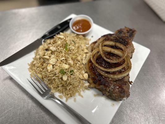 Grilled Ribeye Steak with grilled onions and our crab house rice