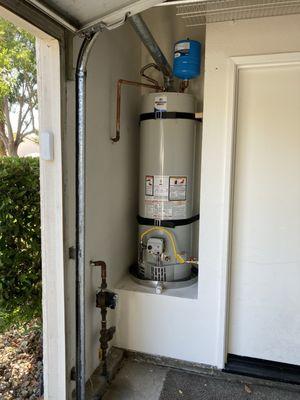 New water heater installed per code.