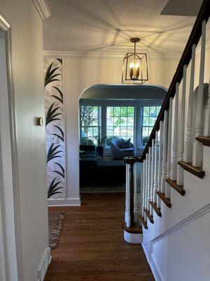 Opening up the entry and first floor en-suite with matching arches made the entry feel like it had always been.