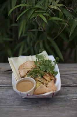 Shrimp Fried Rice served over rice with pickled vegetables and shrimp crackers