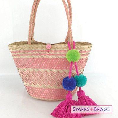 Handwoven mawisa straw bags with whimsical Pom poms.