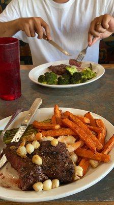 Surf N Turf w/sweet potatos and asparagus and the New York Steak w/ steamed broccoli and asparagus.