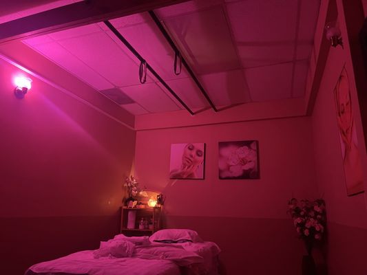 Massage Rooms have soft rose lighting