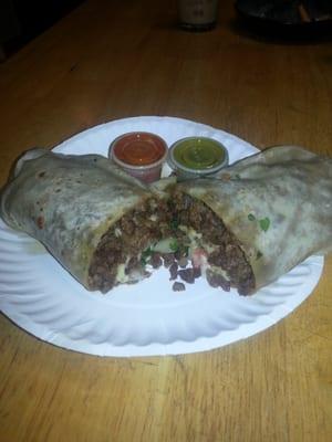 Steak burrito with onion, tomatoe, cilantro, beans and cheese. Very tasty!