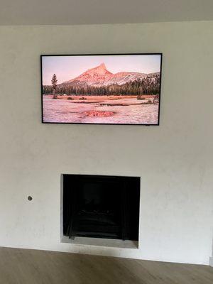 TV mounted on Concrete fireplace