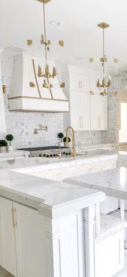 Aphrodite counters and white shaker cabinets