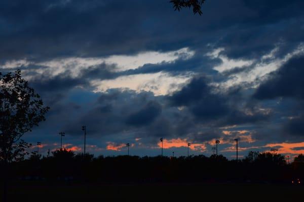 Sunset over the baseball fields after the storms