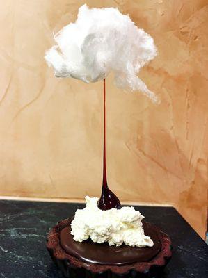 We call this the cloud dessert. Double chocolate tart with caramel, whipped cream, candied hazelnut and white cotton candy