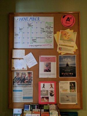 Our commUNITY bulletin board, featuring upcoming studio events and a monthly calendar.