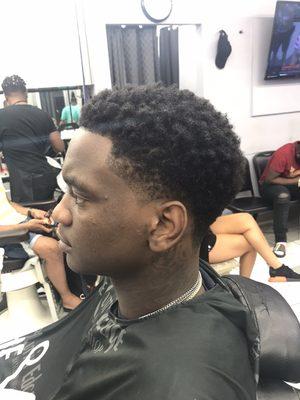 Afro taper with a razor line up