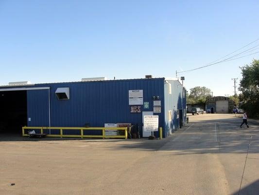 View from the street.  Recycling to the left office to the right.