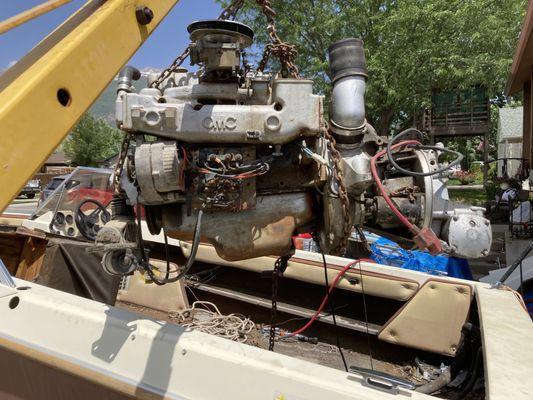 Removing the transom and engine from an old boat.