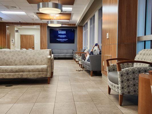 Beautiful lobby and a woman's bare feet on the furniture...