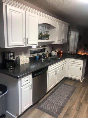 Resurfaced Cabinets sink wall. Changed Valance/Shelf and added Crown Molding.