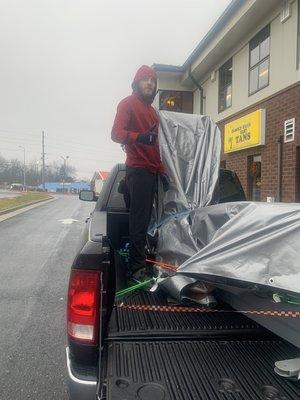 This picture shows how our guys protect furniture due to weather conditions.