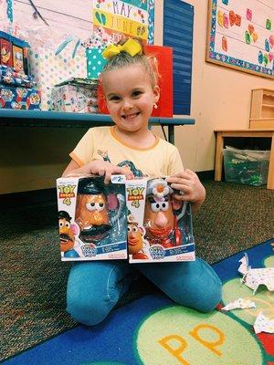 Here's one of our rockstar preschoolers with some awesome toys for her classroom!