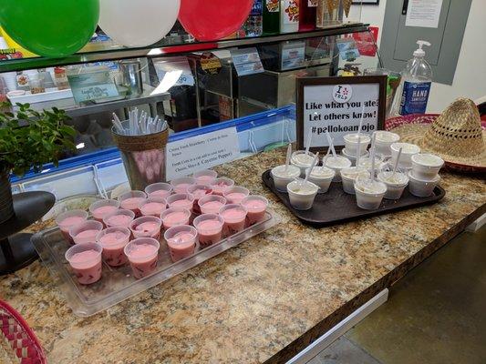 Samples of creme fresh strawberry and fresh corn with cheese, mayo, and cayenne pepper.