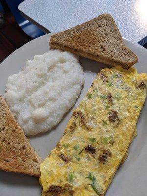 Cajun omelette with grits and wheat toast