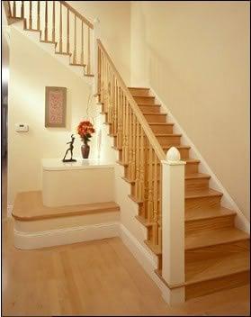 Staircase with bench seat  designed as creative solution to provide headroom for new staircase leading to lower level addition