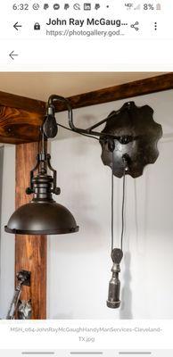 A light made from old farm parts