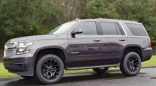 20 inch Black Snowflake Rims with AT Tires on Chevy Tahoe