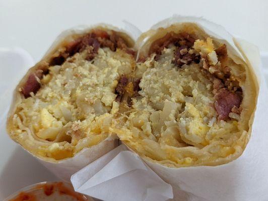 Bacon breakfast burrito. The eggs are made fresh to order.