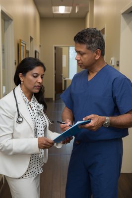 Neurologist, Dr. Ruwani Gunawardane, consulting with Pain Management specialist, Dr. Vajira Gunawardane.