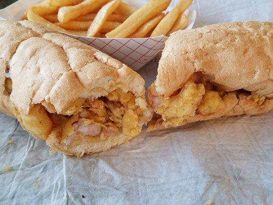 Shrimp poboy and fries. Hmmmm taste like home.