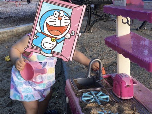 Lots of toys by the sandbox, our 1-year-old loves this playground!