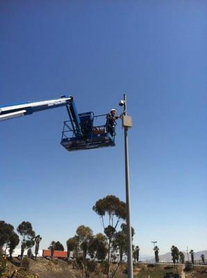 One of our team members inspecting a new camera installed at the Border between the US and Mexico