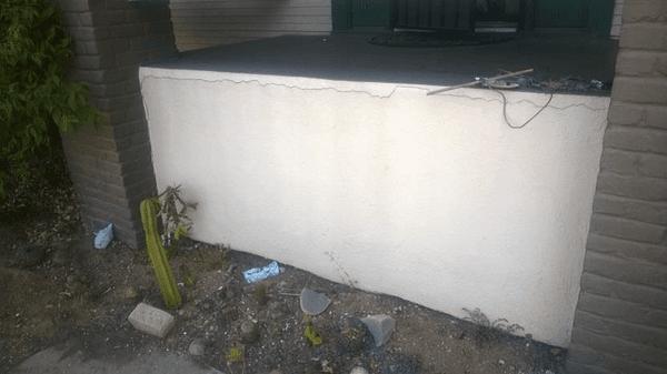 Longitudinal crack across entire porch stucco from rotating column stresses