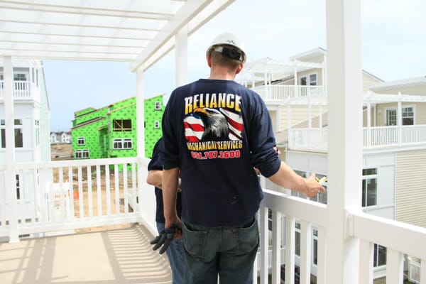 2,500 new homes under contract, in the foreground Sr. project Manager Michael Waligoria consults with principle of RMS 