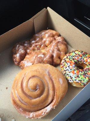 Apple fritter, cinnamon roll and sprinkles! Very light and fluffy! Big too!