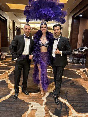 Our Las Vegas showgirl in purple and male models are the perfect greeters for your event.